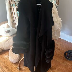 Woman’s Saks Fifth Avenue sweater fur sleeves